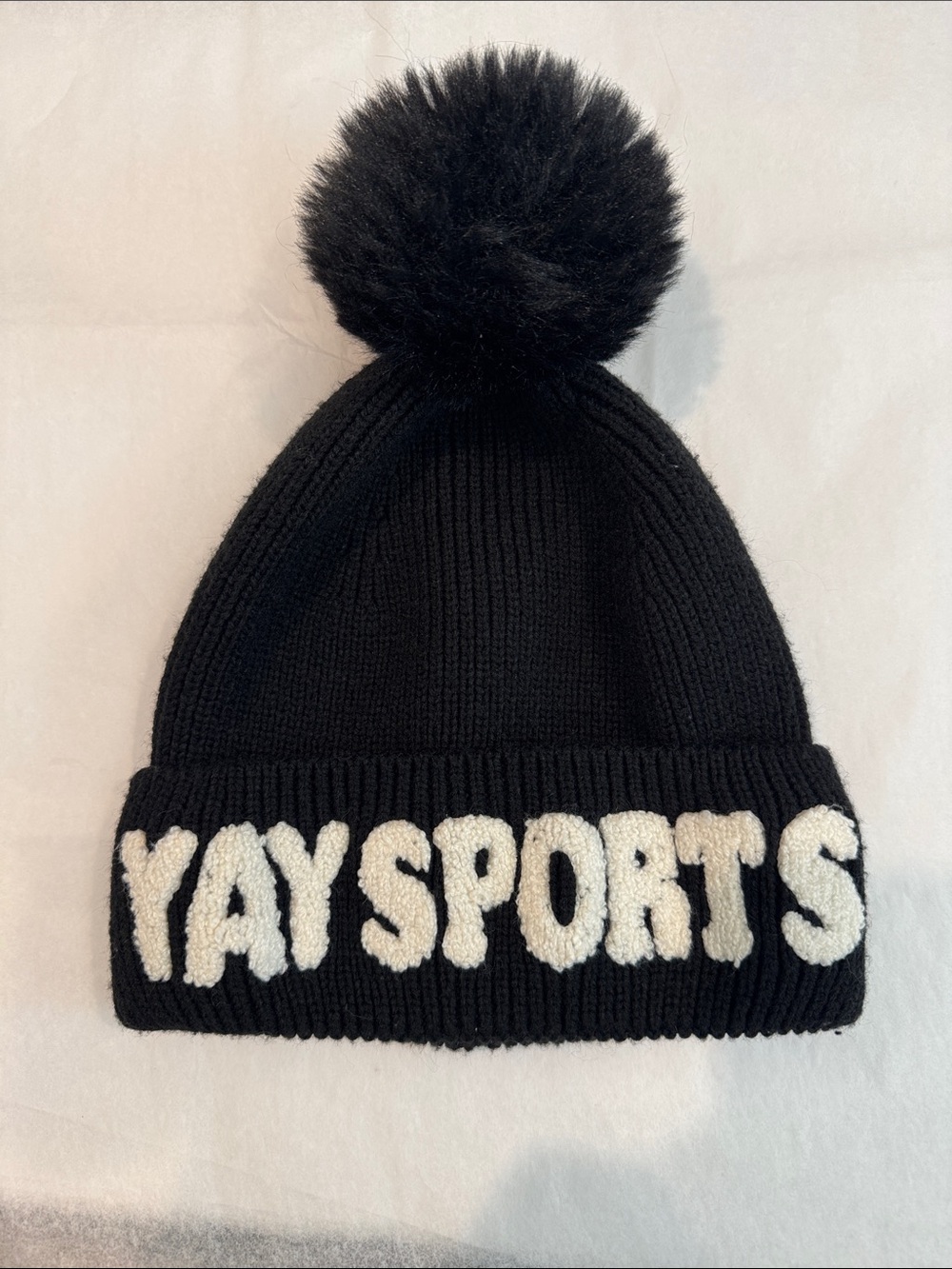 Serra Black Pom Knit Beanie with White Lettering